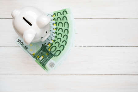 Piggy bank with one hundred euro notesの写真素材