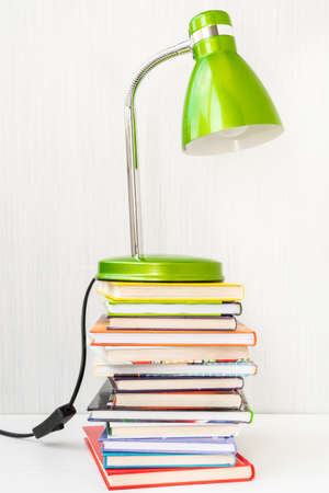 Table lamp and a stack of books,education conceptの写真素材