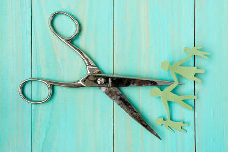 Scissors cutting paper cut of family. Divorce conceptの写真素材
