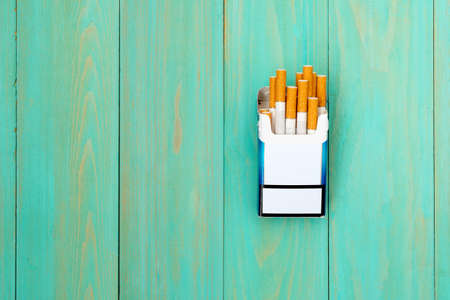 Open cigarettes in pack and tobacco. STOP Smoking. Cigarette with brown filter in the box,copy spaceの写真素材