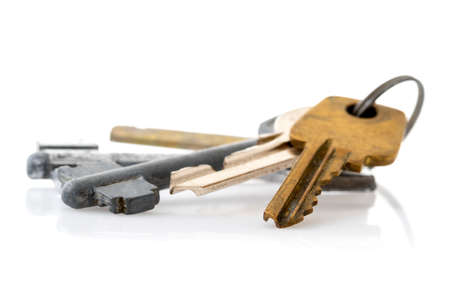 Bunch of old keys isolated on white background