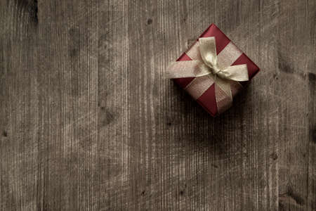 Gift box over wood with copy space, top view