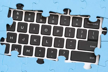  Computer keyboard with frame from jigsaw puzzle . Computer problems solving conceptの写真素材
