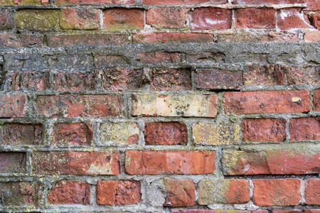 Weathered stained old brick wall background