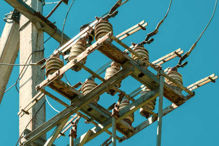 Power lines on sky background, close-up. Wires of high voltage in sky.