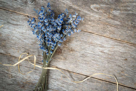 Bunch of dry lavender flowers on the wooden backgroundの写真素材