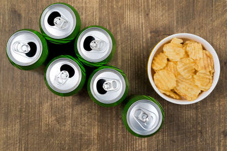 Set of football or basketball fan - beer cans and chipsの写真素材