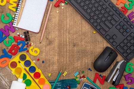 School supplies or stationery accessories on the wooden background with copy-spaceの写真素材