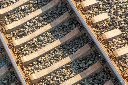 Railway track close-up. Railway track rails and sleepers. Top view.