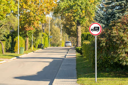 Road sign prohibits trespassing vehicles heavier than 8 tonの写真素材