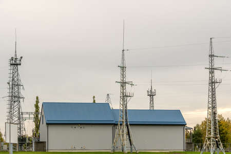 Buildings and towers of high voltage power transformer substationの写真素材