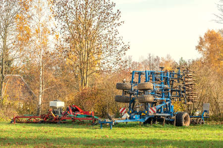 Agricultural implements standing in a farm after summer seasonの写真素材