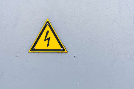 High voltage warning sign on high-voltage substationの写真素材