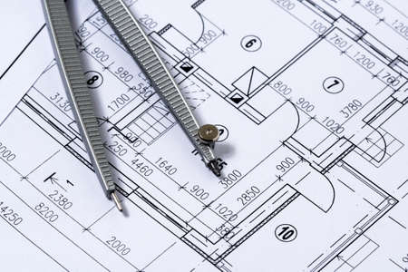 Engineering drawings with pair of compass. Close up view.の写真素材