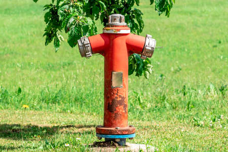 Red Fire Hydrant sits and waits to be used for the local homes