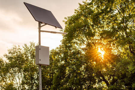 Solar panel and LED street light with natural background before sunsetの写真素材
