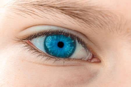 Child's blue eye. Macro with shallow depth of field.の写真素材