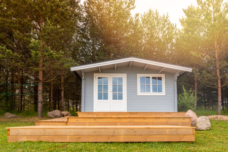Small European-style resort wooden house or wooden hut in a pine forestのeditorial素材