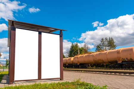 Mock up Blank board Train station Platform with cargo transportationの写真素材