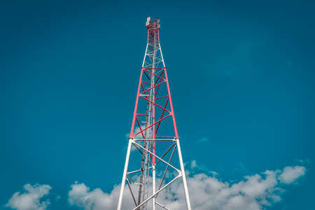 Low angle view of telecommunication tower against sky backgroundの写真素材