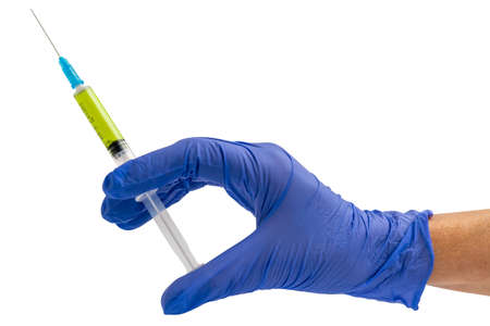 Hand in a blue glove holding syringe isolated on white. Medical concept with syringe for...