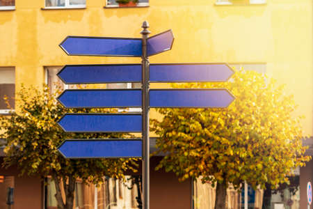Blue blank directional signs on the city streetの写真素材