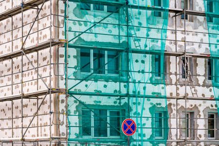 Thermal insulation with polystyrene in old multi story building.