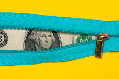One Dollar Bill With Zipper on Yellow Background. Financial concept.