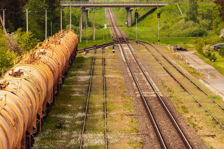 Set of train tanks with oil or fuel waiting on the stationの写真素材