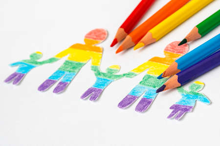 Paper family colored in LGBT rainbow colors. The concept of lgbt friendly and toleranceの写真素材