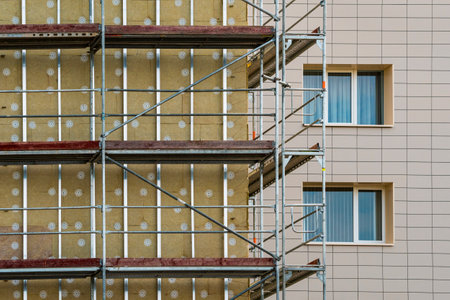 Multistory house thermal insulation mineral wool slabs. Outside wall heat isolation with mineral...