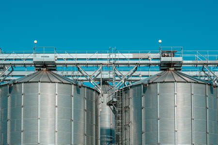 Silver silos on agro-processing and manufacturing plantの写真素材