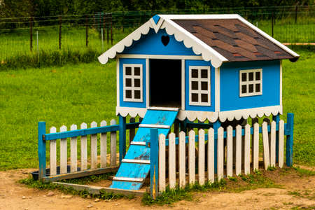 Decorative house for domestic rabbits. Rabbit house on the grass in the garden.の写真素材