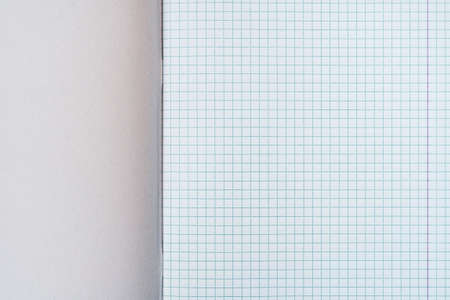 Open squared school notebook, close up view. Copy-space.