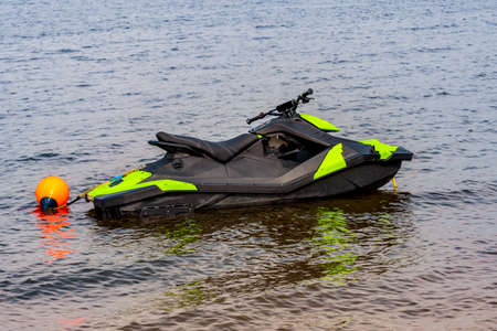 Modern Jet Ski in the surf near shore in the lake