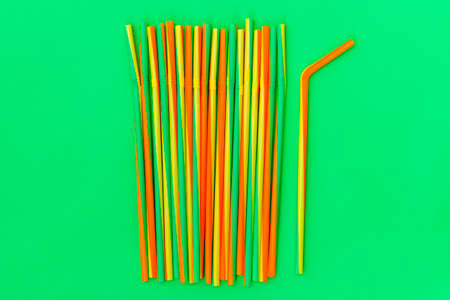 Colorful coctail straws on green background. Birthday, party, celebration  concept.の写真素材