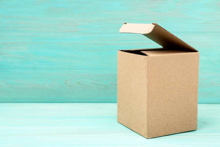 Open box on blue wooden background. Copy space.の写真素材
