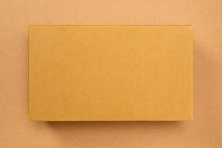 Cardboard brown box or Craft package box. Top view, copy space.の写真素材