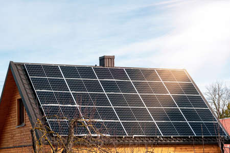 Solar panels on roof of the residential house. Clean energy. Ecological concept