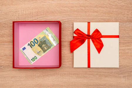 Money as a gift, Euros in a gift box. Donate money. Top view.の写真素材
