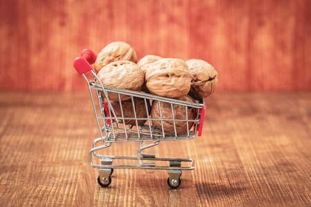 Shopping cart full of walnuts.Vitamins, shopping in the store.