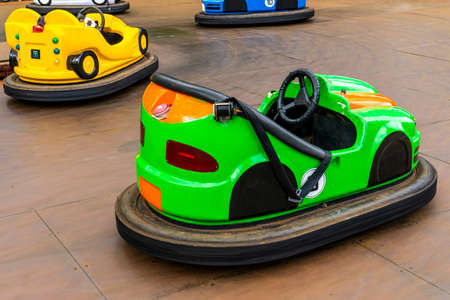 Colorful bumper cars at the amusement park. Fairground with attractions. Colorful dodgems.の写真素材
