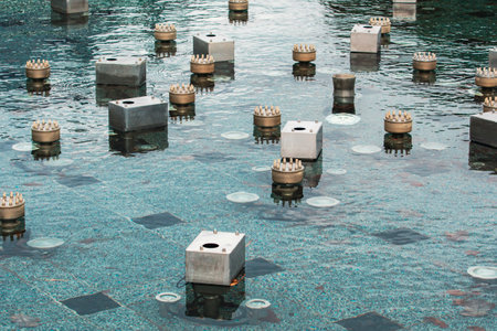 The fountain was turned off for cold season. View of the underwater part of the switched off modern fountain.の写真素材