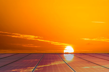 Sunset and solar panel, photovoltaic, alternative electricity source - concept of sustainable...