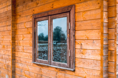 Perspective view to window of an ecological wooden houseの写真素材