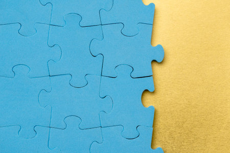 Blue puzzle frame with golden background for your business or connection messageの写真素材