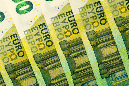 Green banknotes of 100 euros beautifully laid out.European Union banking, financial savings.