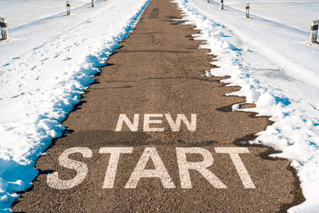 Start line on the highway with melting snow. Concept for business planning, strategy and challenge or career path, opportunity and change. Spring comming, time for new beginnings.の写真素材