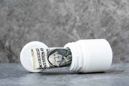 One dollar banknote rolled in the pills bottle. Costs of medication or drug concept, drug...