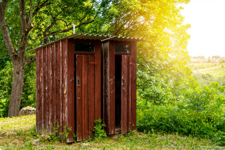 Couple of old wooden toilets in the woods. Outhouse in the wood.の写真素材